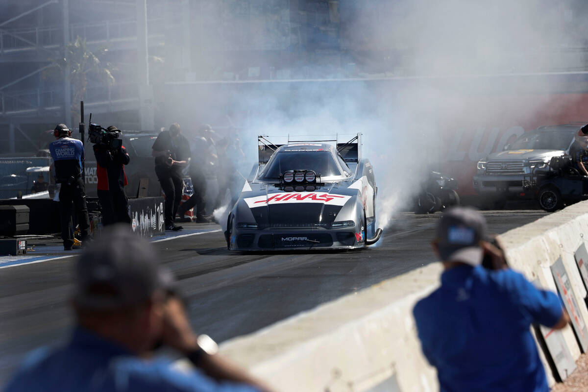 NHRA driver Matt Hagan does a burnout before the second Nitro qualifying session during the NHR ...