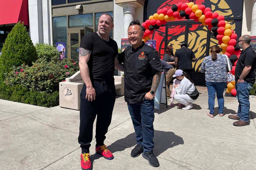 Eric Persson and Jet Tila celebrated the grand opening of the Dragon Tiger Noodle Co.'s latest ...