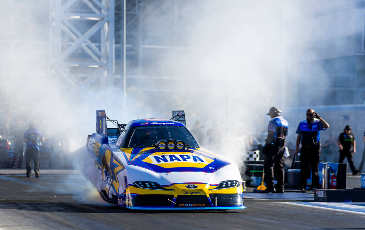 Funny Car driver Ron Capps does a burn out for another qualifying race during Day 2 of NHRA Nat ...