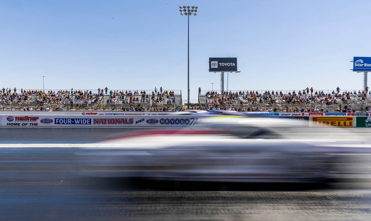 A Pro Stock car races down the track during Day 2 of NHRA Nationals at the Las Vegas Motor Spee ...