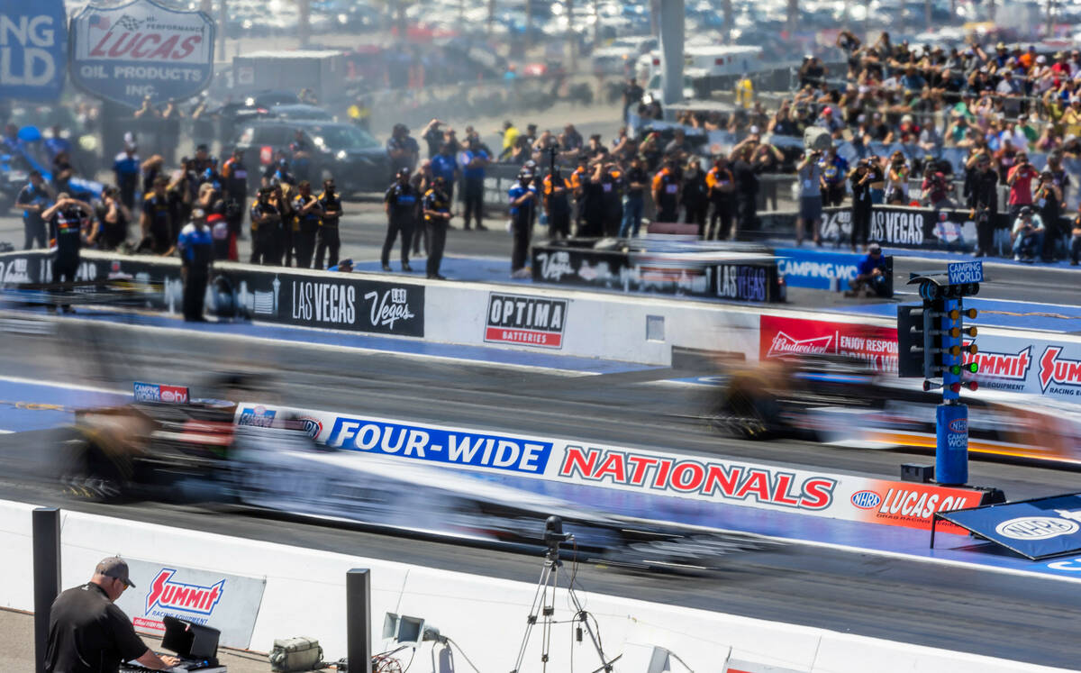 Top Fuel cars compete in qualifying during Day 2 of NHRA Nationals at the Las Vegas Motor Speed ...