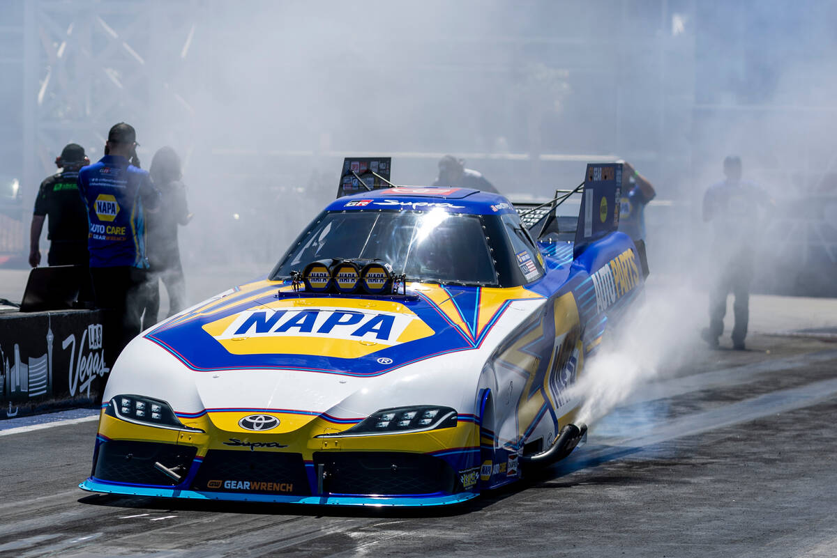 Funny Car driver Ron Capps does a burn out before a qualifying race during Day 2 of NHRA Nation ...