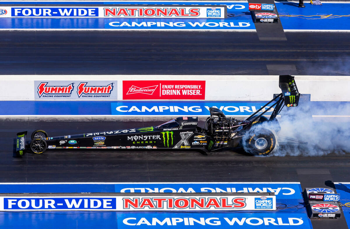 Top Fuel racer Brittany Force does a burn out before a qualifying race during Day 2 of NHRA Nat ...