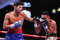 Ryan Garcia, left, connects a punch against Romero Duno during the first round of the WBC Silve ...