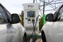 FILE - Electric cars are parked at a charging station in Sacramento, Calif., on April 13, 2022. ...
