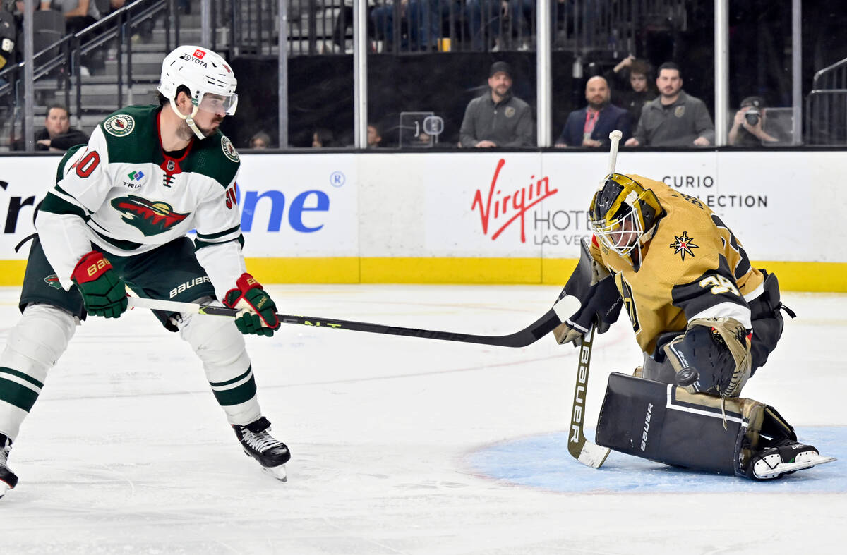 Vegas Golden Knights goaltender Laurent Brossoit (39) makes a save against Minnesota Wild left ...