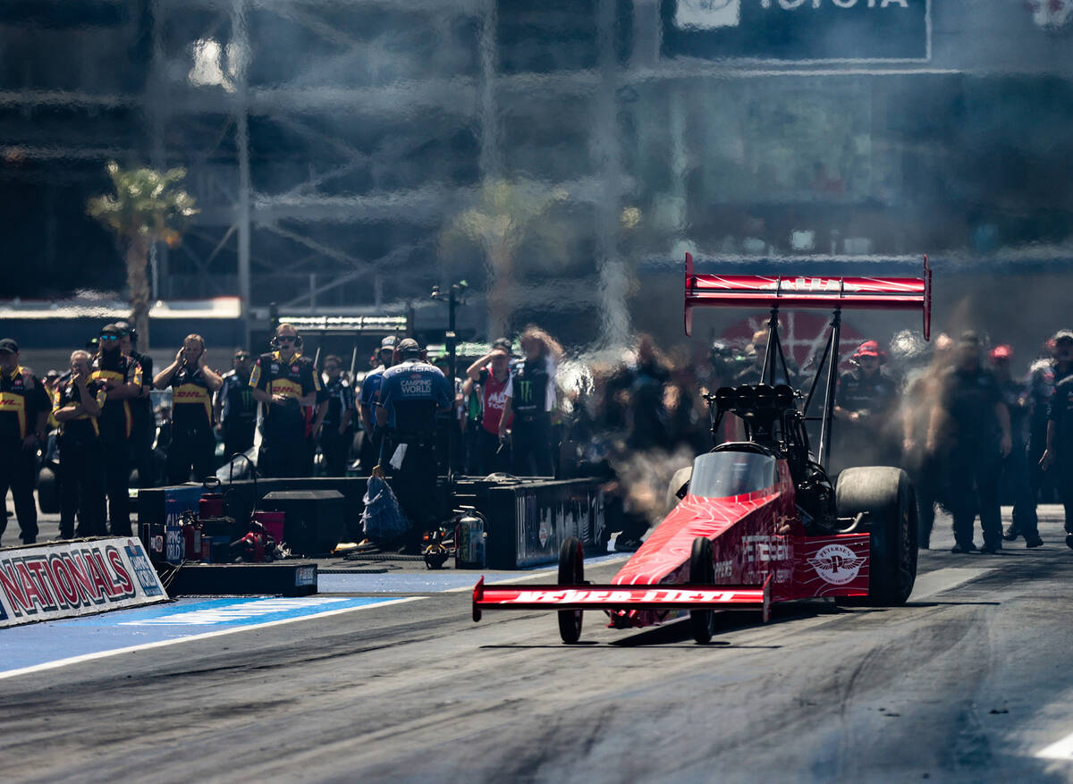Mike Salinas races in a top fuel nitro elimination round at the 4-wide NHRA Nationals at the La ...
