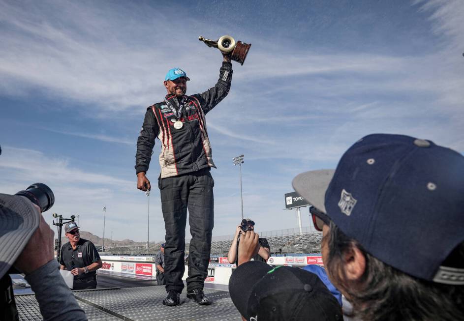 Dallas Glenn greets fans after winning the pro stock competition at the 4-wide NHRA Nationals a ...