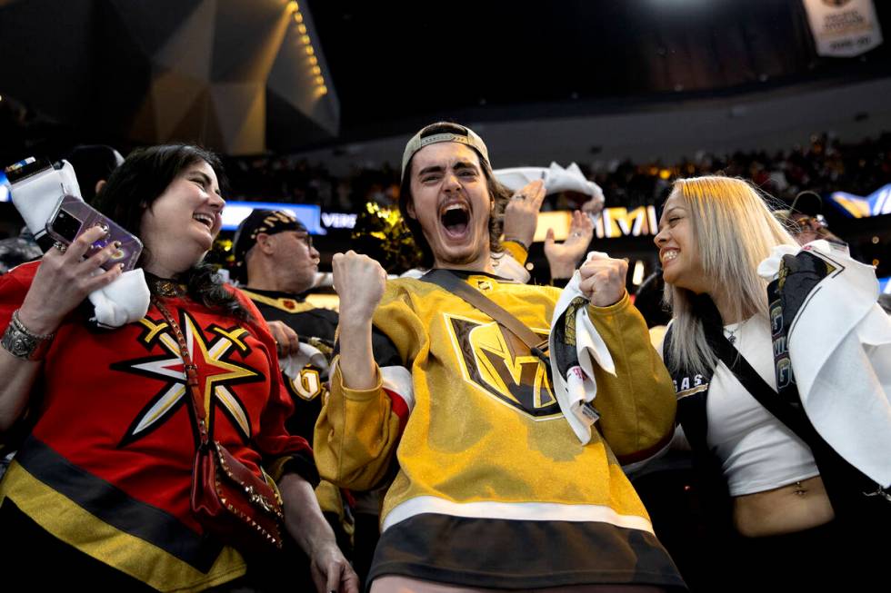 Kathy Banton, left, Robert Kongelbak-Leask and Sandra Cardenas celebrate after the Golden Knigh ...