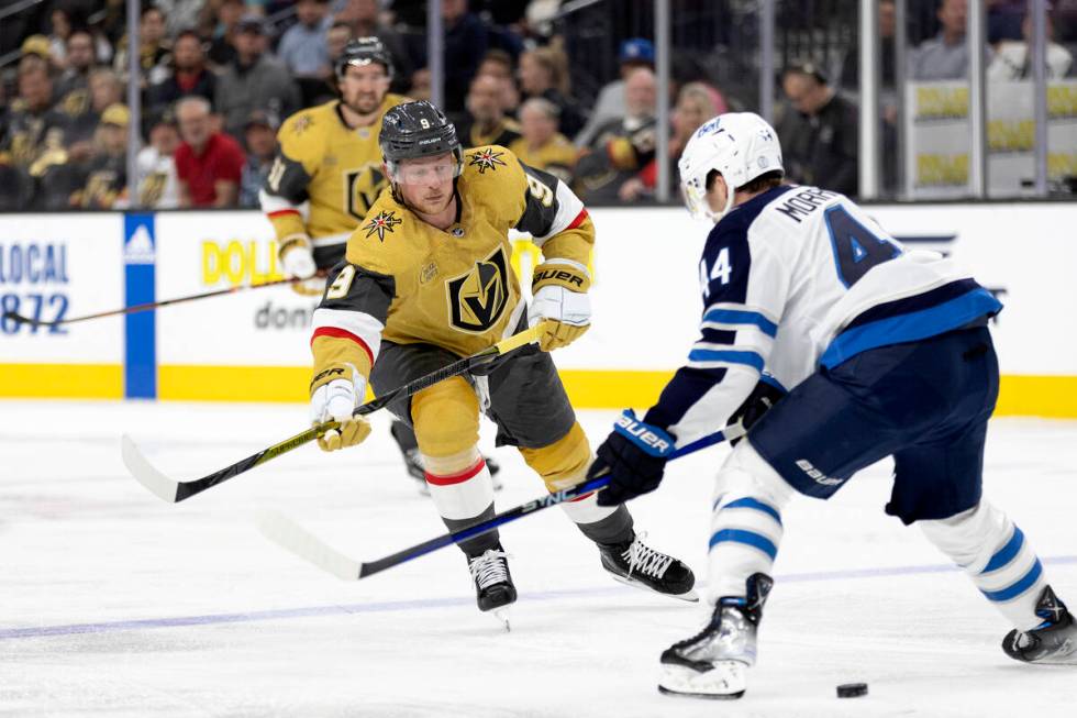 Golden Knights center Jack Eichel (9) skates for the puck against Jets defenseman Josh Morrisse ...