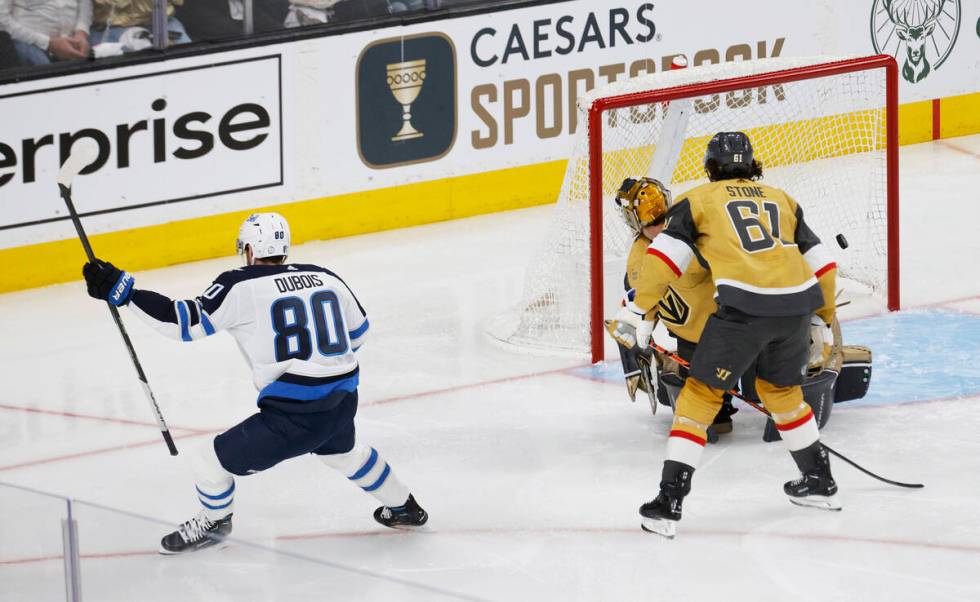 Winnipeg Jets left wing Pierre-Luc Dubois (80) scores a goal against Golden Knights goaltender ...