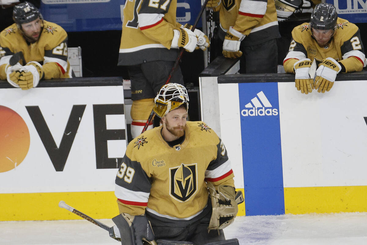 Golden Knights goaltender Laurent Brossoit (39) skates back to the goal after Winnipeg Jets cen ...