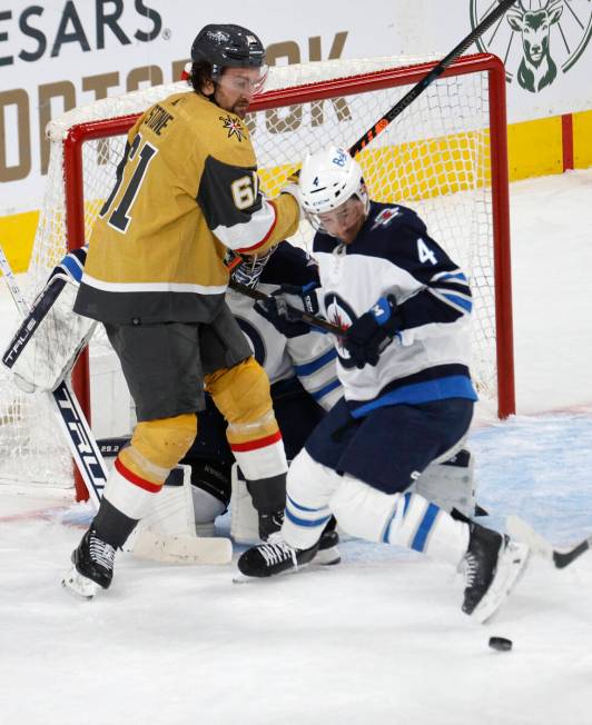 Golden Knights right wing Mark Stone (61) keeps an eye on a puck during the third period of Gam ...