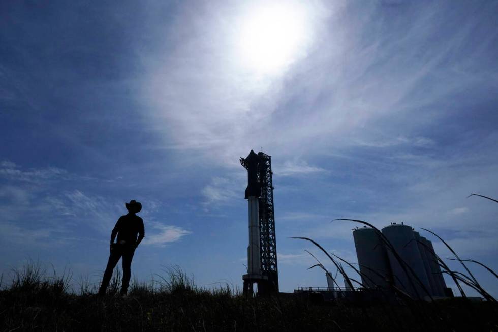 A man walks past the site where SpaceX's Starship, the world's biggest and most powerful rocket ...