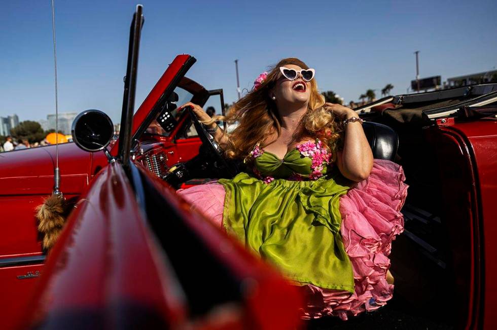 Jody Collins, from Sacramento, Calif., takes photos in a classic car during the Rockabilly Car ...