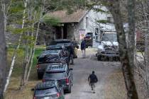 Investigators work at the scene of a deadly shooting, Tuesday, April 18, 2023, in Bowdoin, Main ...