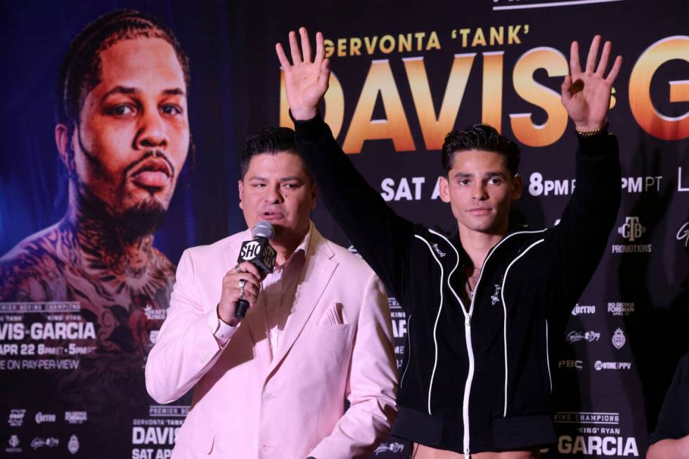 Ryan Garcia, right, acknowledges the crowd after talking to to Premier Boxing Champions host Ra ...