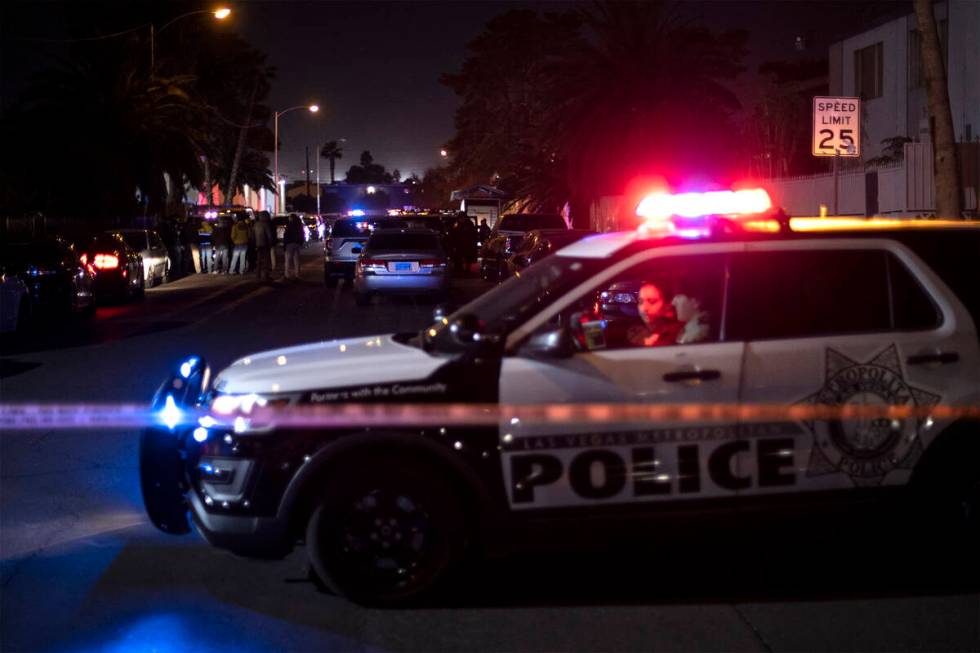 Metropolitan Police Department officers investigate a homicide in the 3800 block of Royal Crest ...