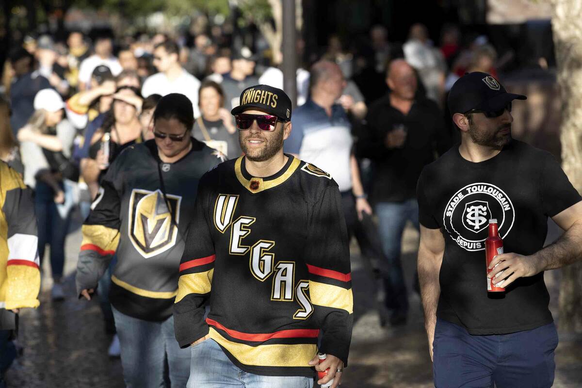 Golden Knights fans head toward T-Mobile Arena before Game 2 of an NHL hockey Stanley Cup first ...