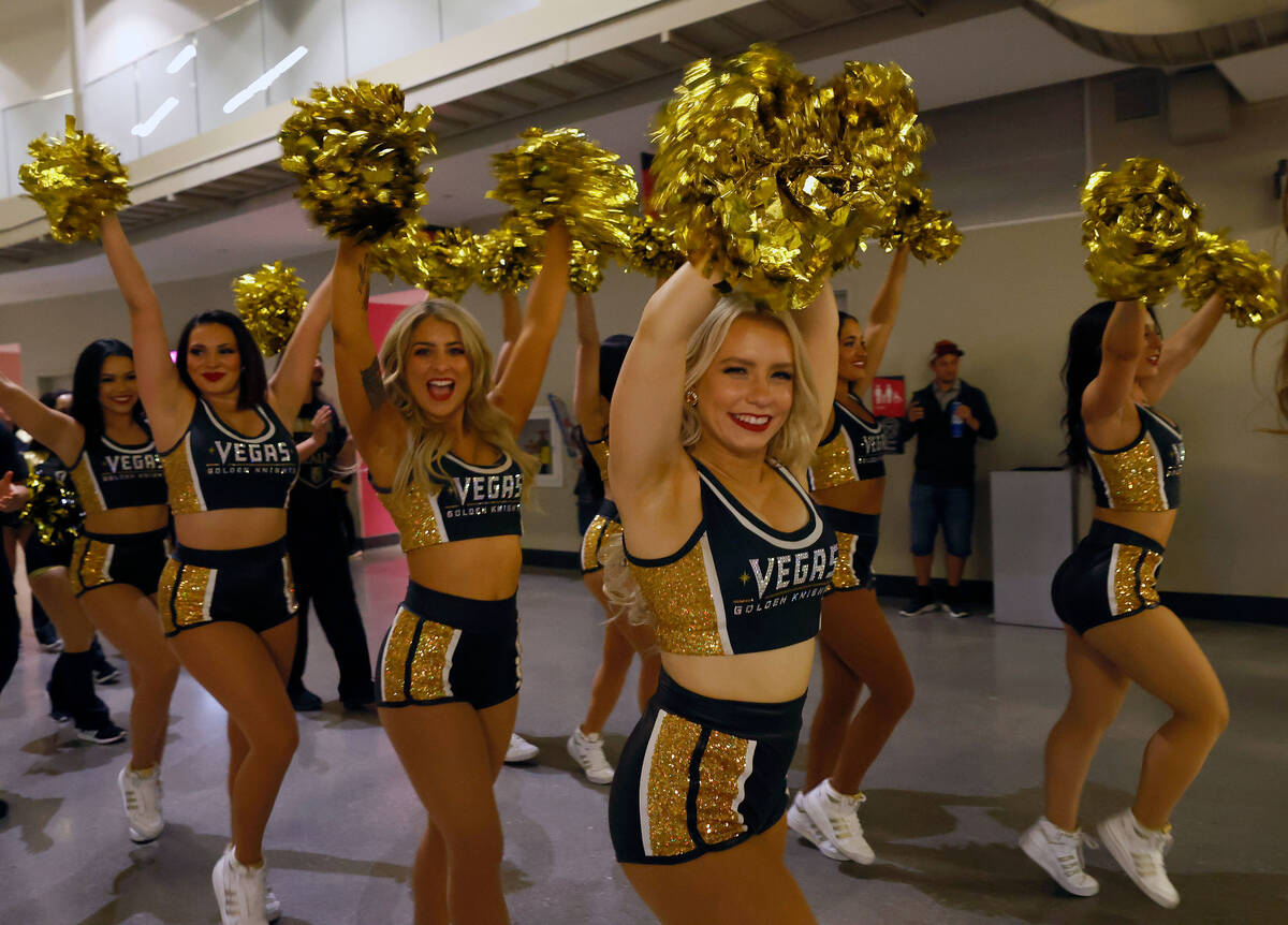 The Golden Knights Vegas Vivas cheerleaders march inside T-Mobile Arena before Game 2 of an NHL ...