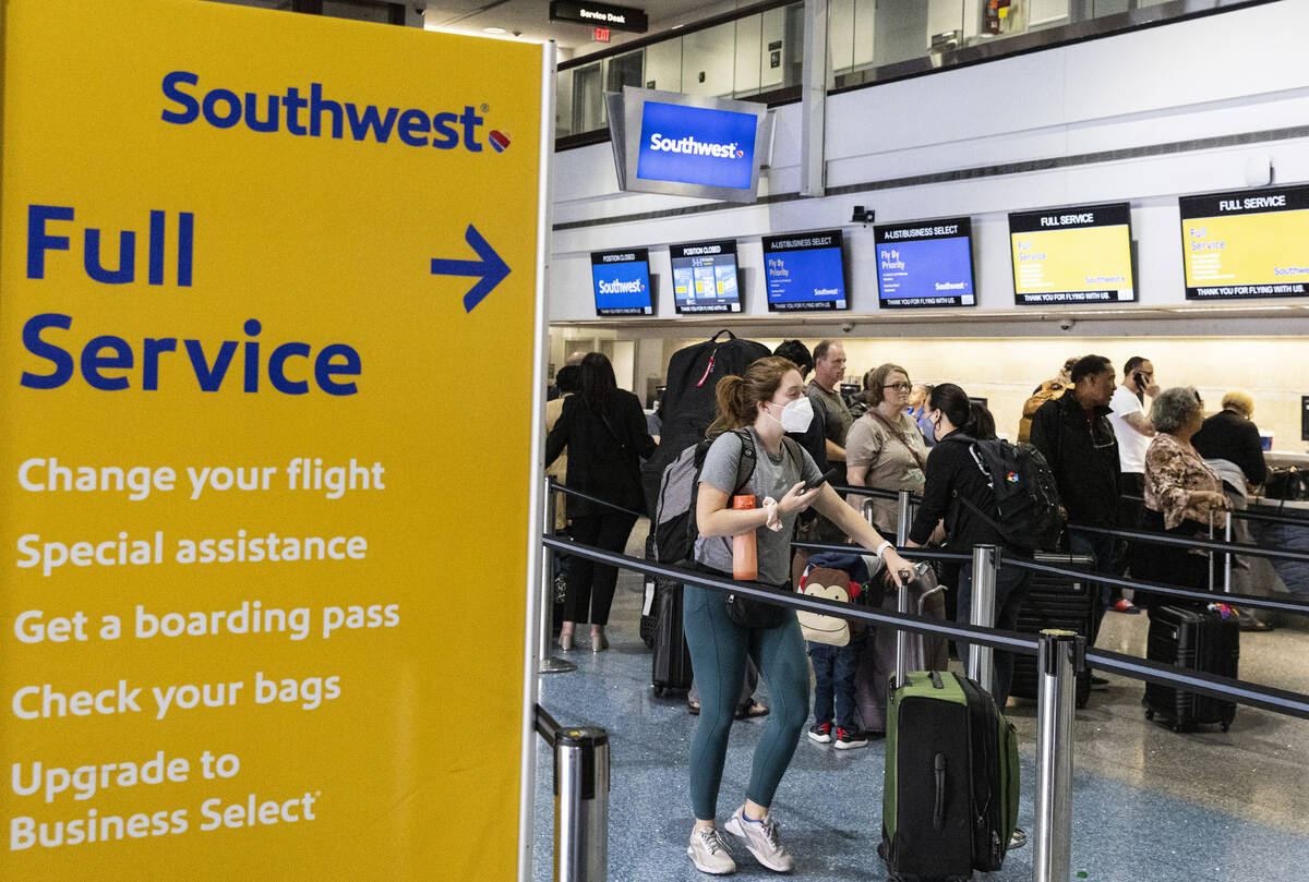 Passengers line up to check in at Southwest check in counter in Terminal 1 of Harry Reid Intern ...