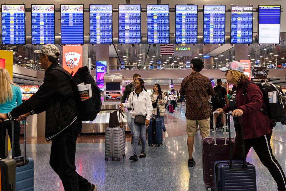 Passengers arrive in Terminal 1 of Harry Reid International Airport, on Friday, April 21, 2023, ...