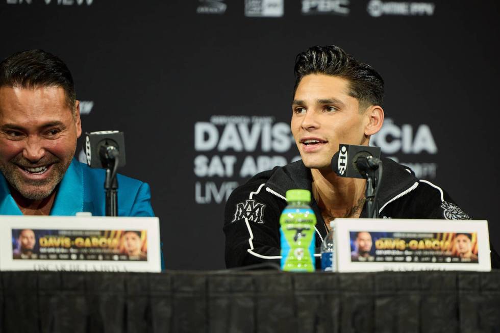 Ryan Garcia, right, speaks alongside promoter Oscar De La Hoya during the final press conferenc ...