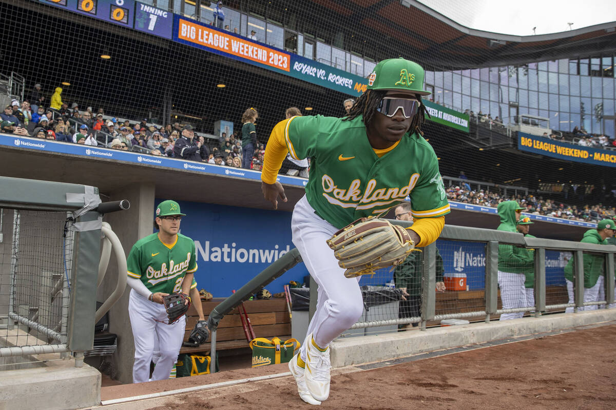 Oakland Athletics center fielder Lawrence Butler (77) takes the field for the first inning of a ...