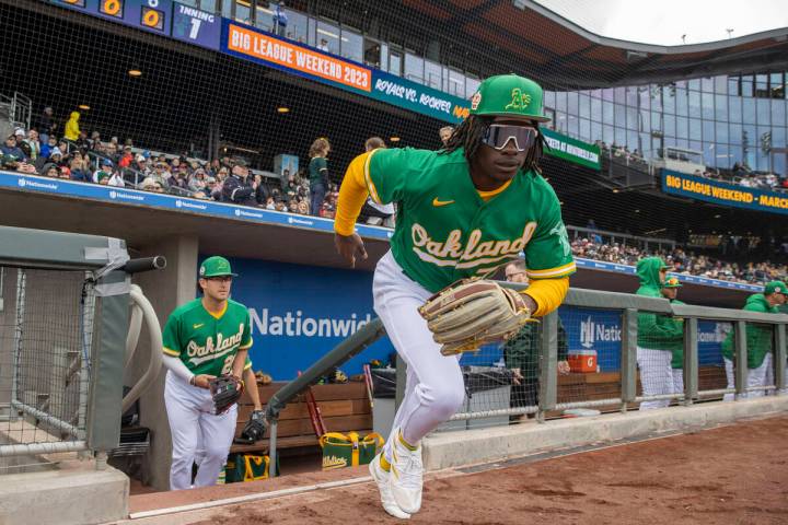 Oakland Athletics center fielder Lawrence Butler (77) takes the field for the first inning of a ...