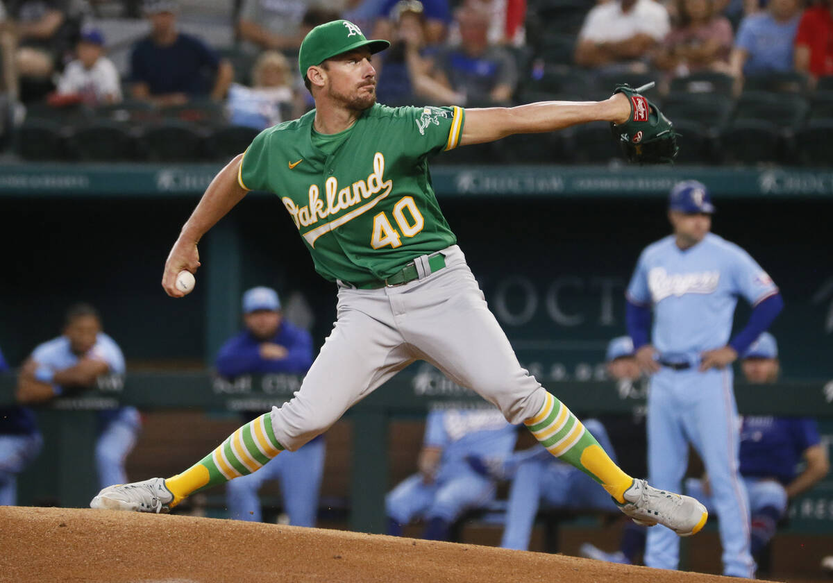 Oakland Athletics starting pitcher Chris Bassitt throws against the Texas Rangers during the fi ...