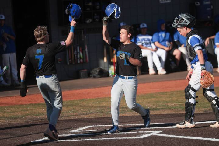 Green Valley's Connor Apeceche (17) celebrates his home run with Green Valley's Brady Ballinger ...