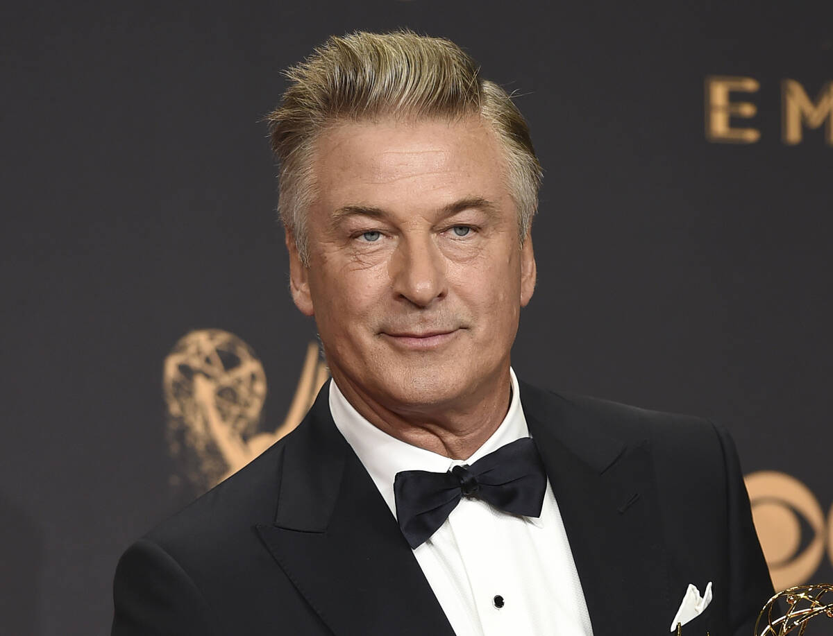 FILE - Alec Baldwin poses in the press room with the award for outstanding supporting actor in ...
