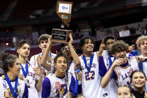 Durango poses for photos with their NIAA Class 5A boys high school basketball state championshi ...