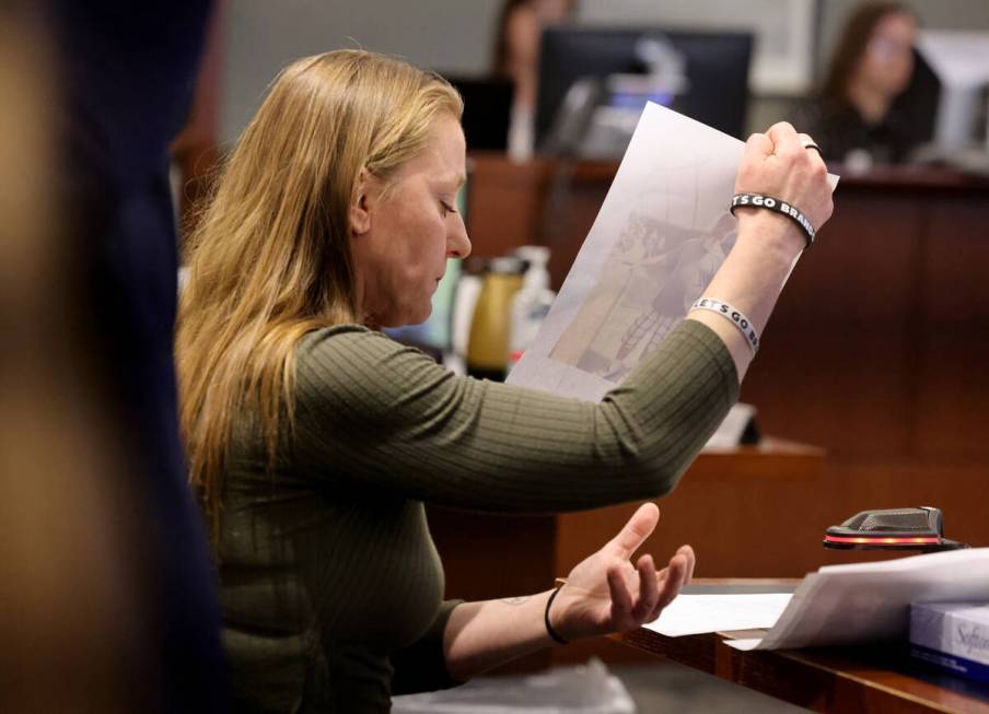 Jennifer Saltzman, wife of Rodney Saltzman, shows photos during her victim impact statement dur ...