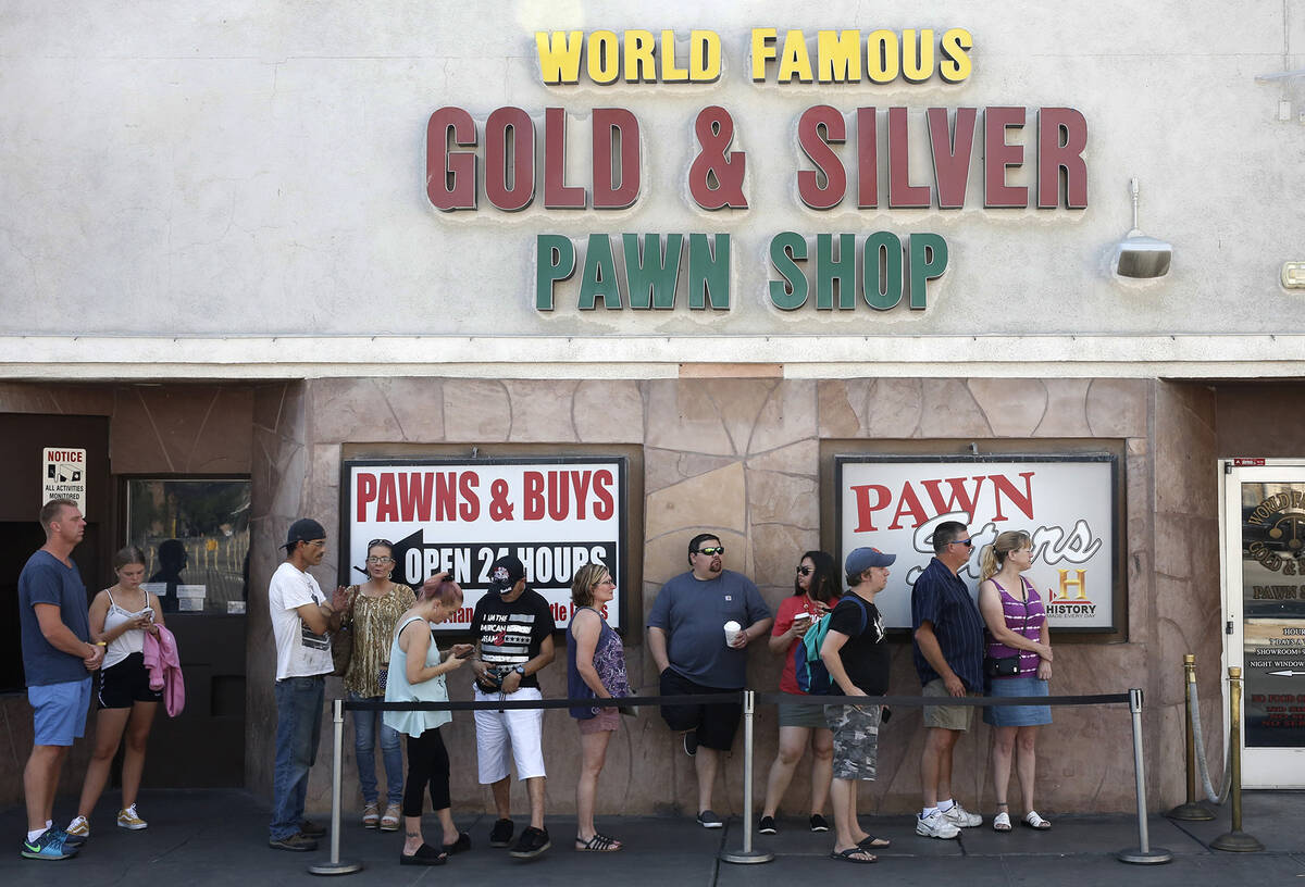 People wait in line to enter the Gold and Silver Pawn Shop in Las Vegas on Monday, June 25, 201 ...