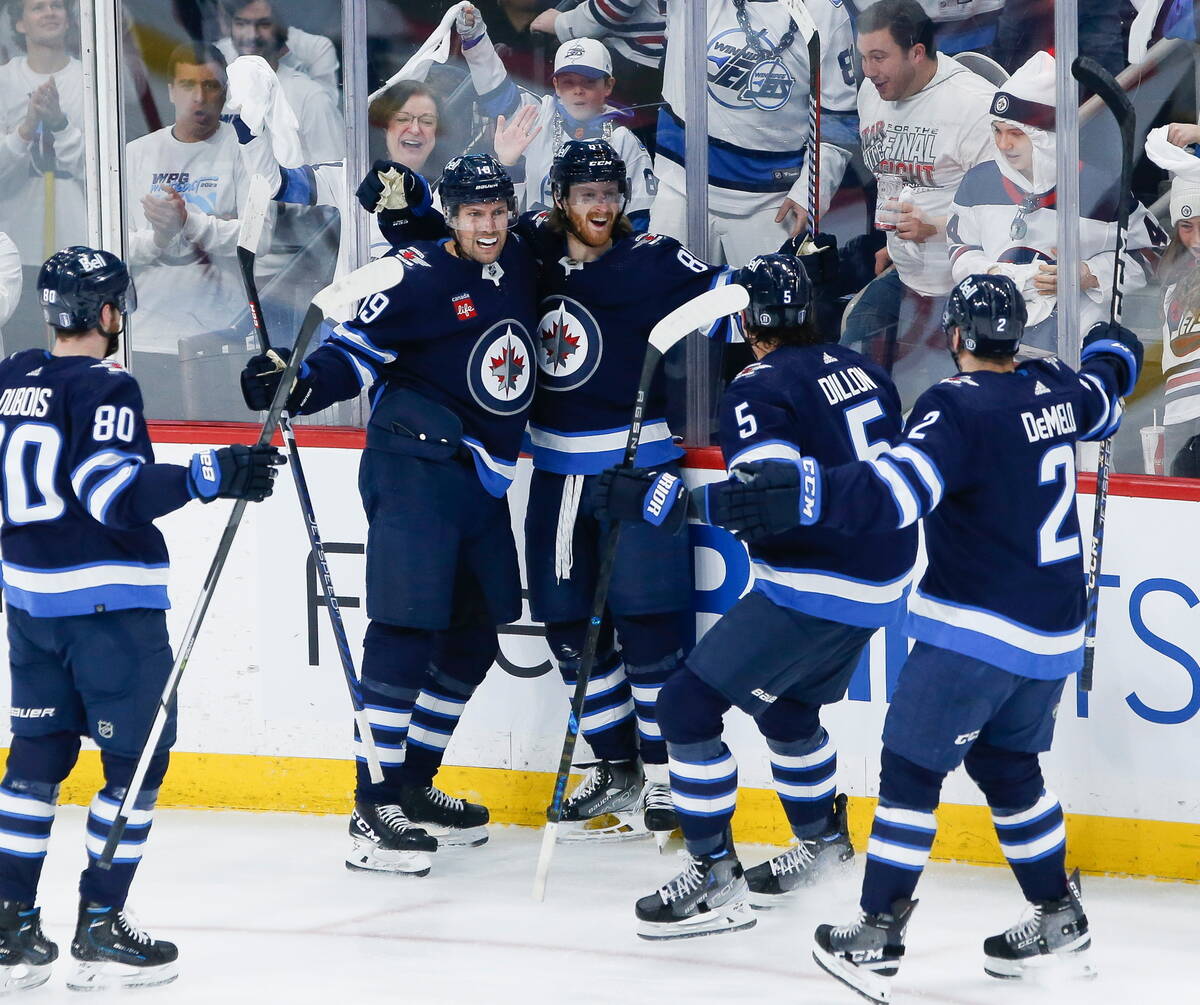 Winnipeg Jets' Pierre-Luc Dubois (80), David Gustafsson (19), Kyle Connor (81), Brenden Dillon ...