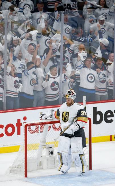 Winnipeg Jets fans celebrate Adam Lowry's (17) game-tying goal past Vegas Golden Knights goalte ...