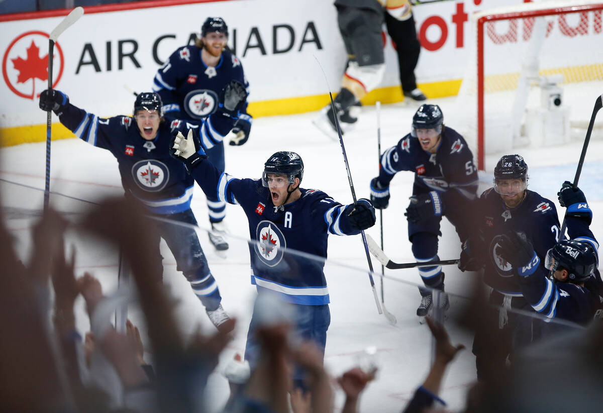 Winnipeg Jets' Adam Lowry (17) celebrates his game-tying goal against the Vegas Golden Knights ...