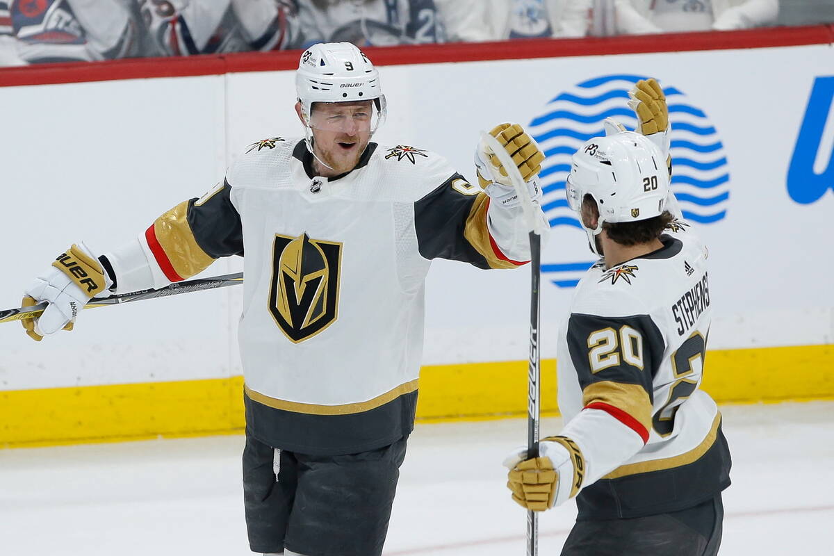 Vegas Golden Knights' Jack Eichel (9) and Chandler Stephenson (20) celebrate Eichel's goal agai ...