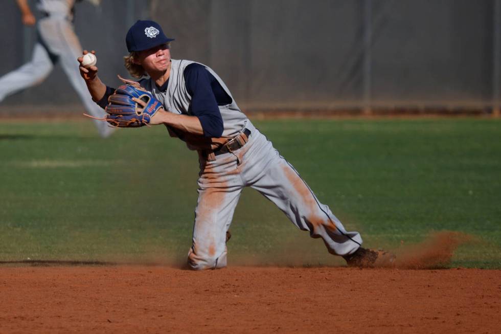 Centennial's Albert Cohen (14) throws a ball to the second base during the fourth inning of a b ...