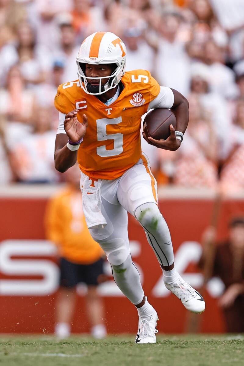 FILE - Tennessee quarterback Hendon Hooker (5) runs for yardage during the second half of an NC ...