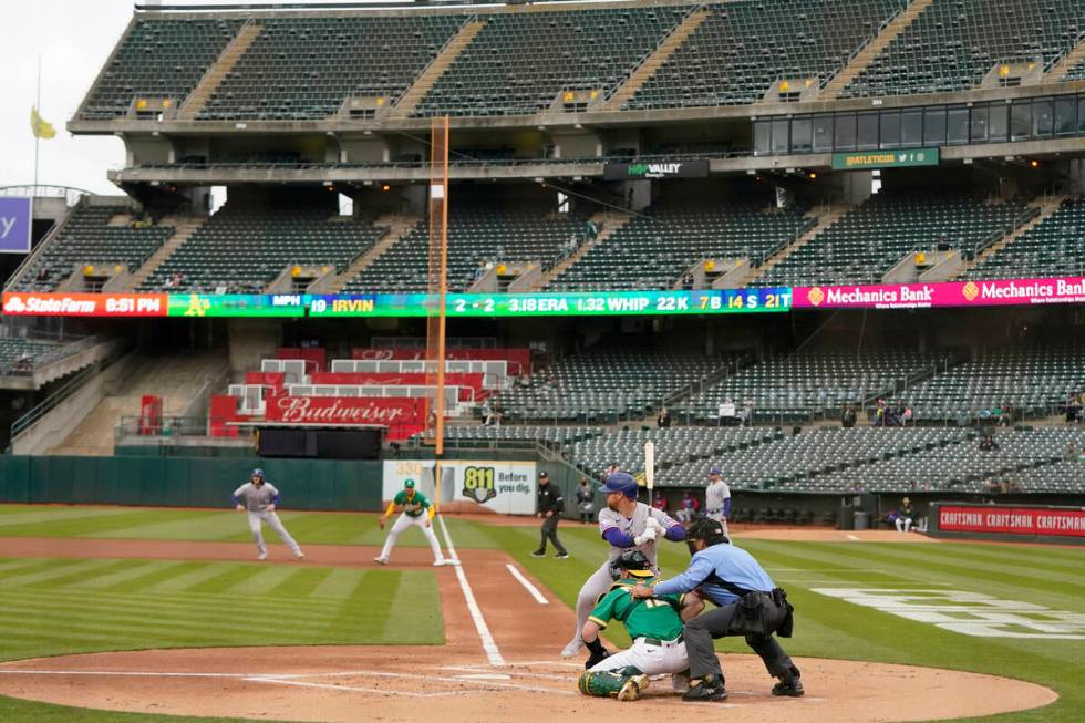 Texas Rangers' Kole Calhoun bats during a baseball game against the Oakland Athletics in Oaklan ...