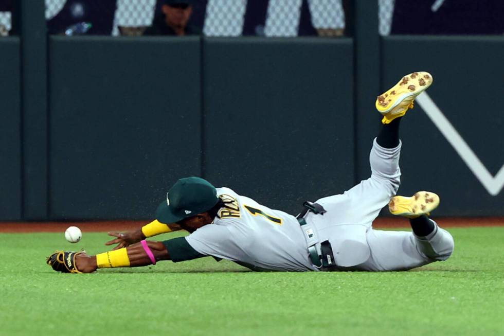 Oakland Athletics center fielder Esteury Ruiz (1) loses a ball hit by Texas Rangers Leody Taver ...