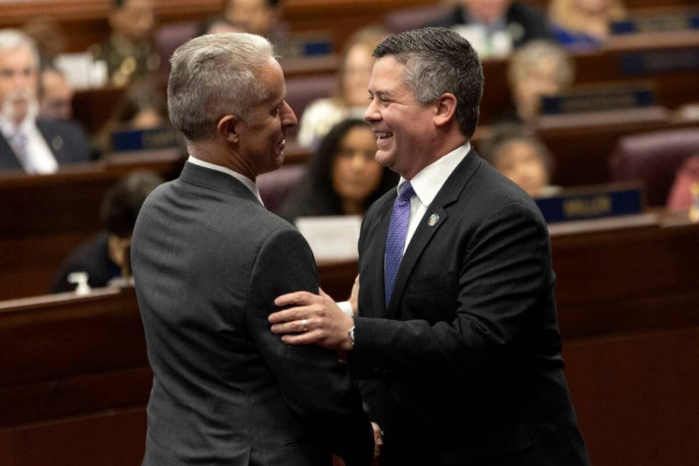 Assemblymen Toby Yurek, R-Henderson, left, and Steve Yeager, D-Las Vegas, greet each other duri ...