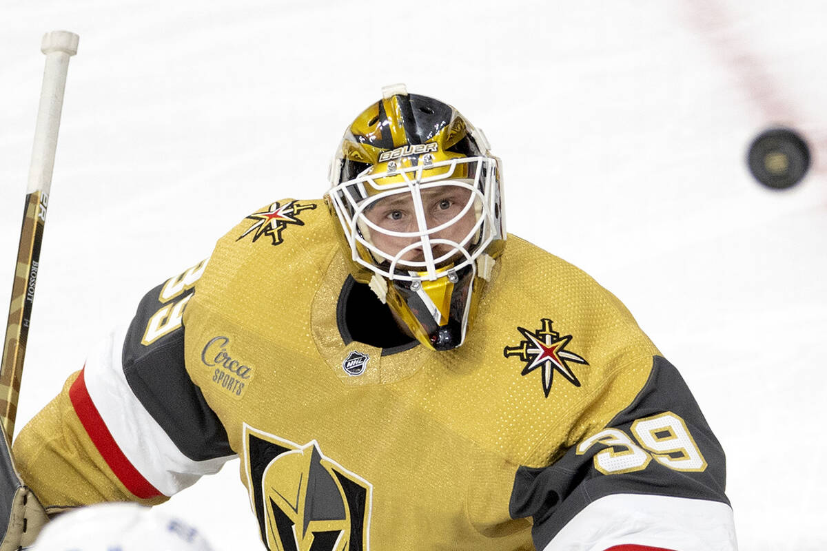 Golden Knights goaltender Laurent Brossoit (39) watches the puck after making a save during the ...