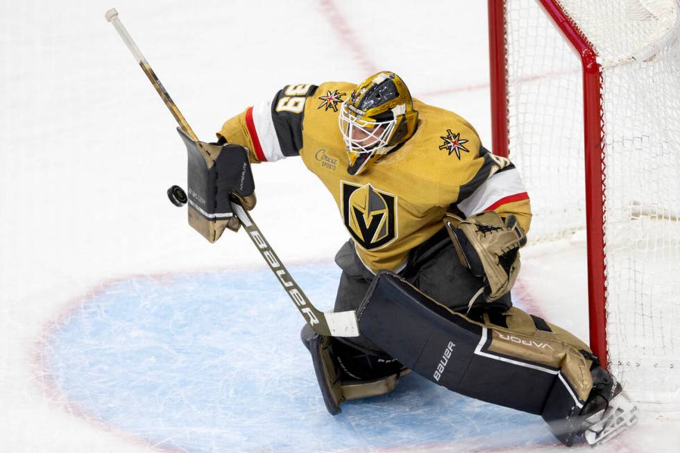 Golden Knights goaltender Laurent Brossoit (39) saves the puck during the third period in Game ...