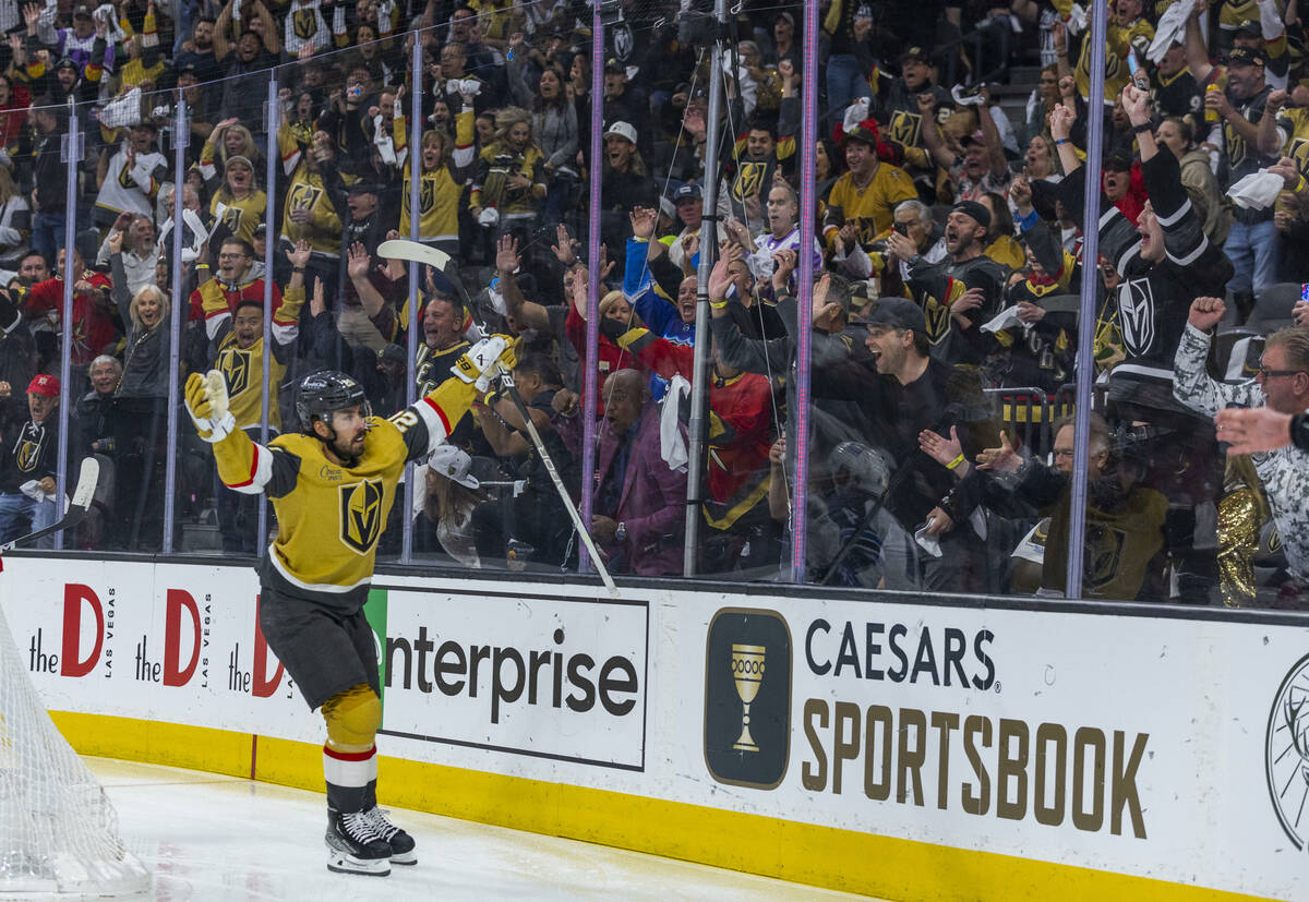 Golden Knights center Chandler Stephenson (20) celebrates scoring the first goal over Winnipeg ...