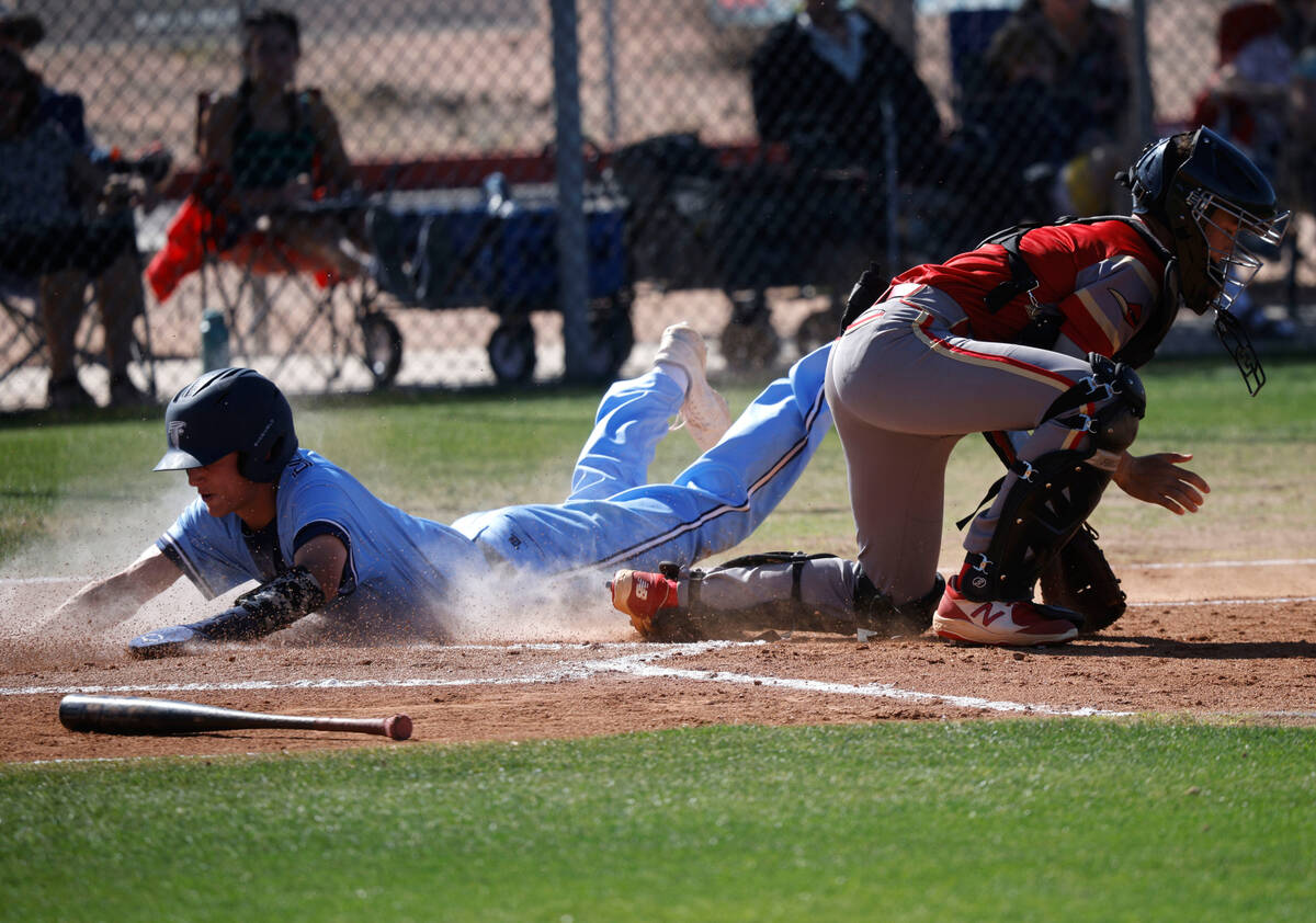 Foothill's Andrew Durham (8) slides safely into home plate as Southeast Career Tech's Bruce Trz ...