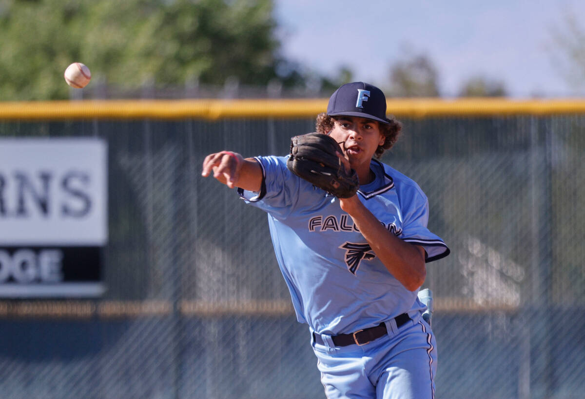 Foothill's Lloyd Strother (42) throws the ball hit by Southeast Career Tech's Kentin Grantz (17 ...