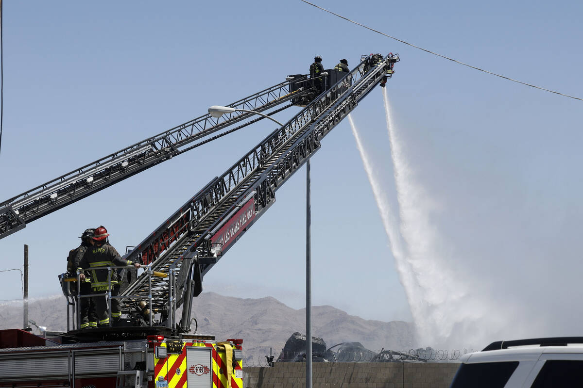 North Las Vegas firefighters try to extinguish a fire around 4565 E. Hammer Lane, Tuesday, Apri ...